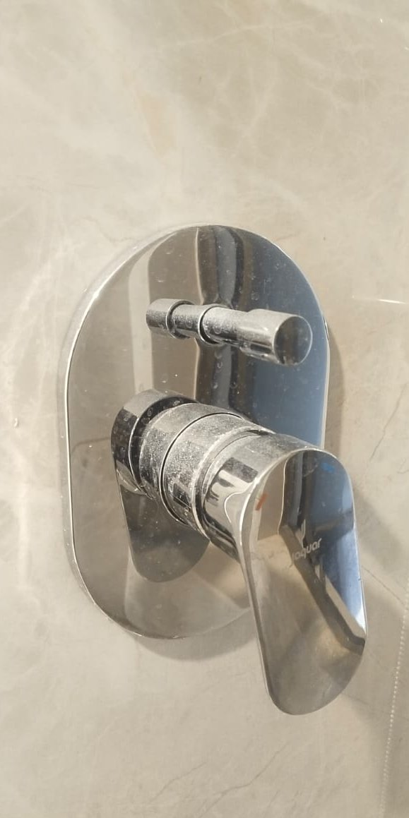 Chrome mixer, limescale removed — before cleaning