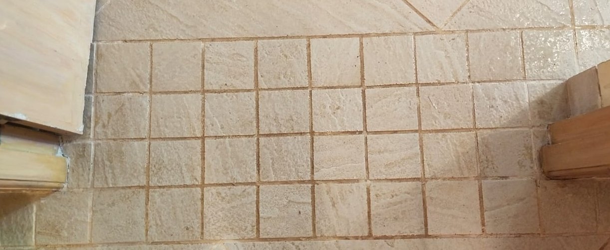 Grime lifted from grout — before cleaning