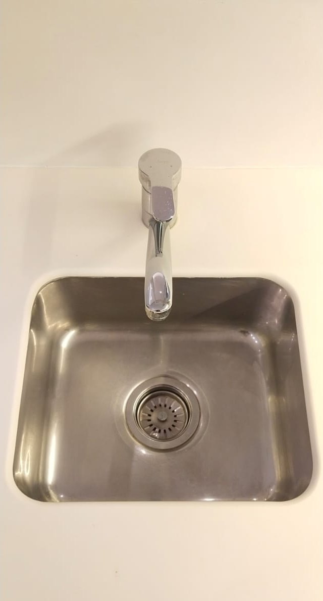 Sink, builders’ residue scoured out — after cleaning by Filth Fighters
