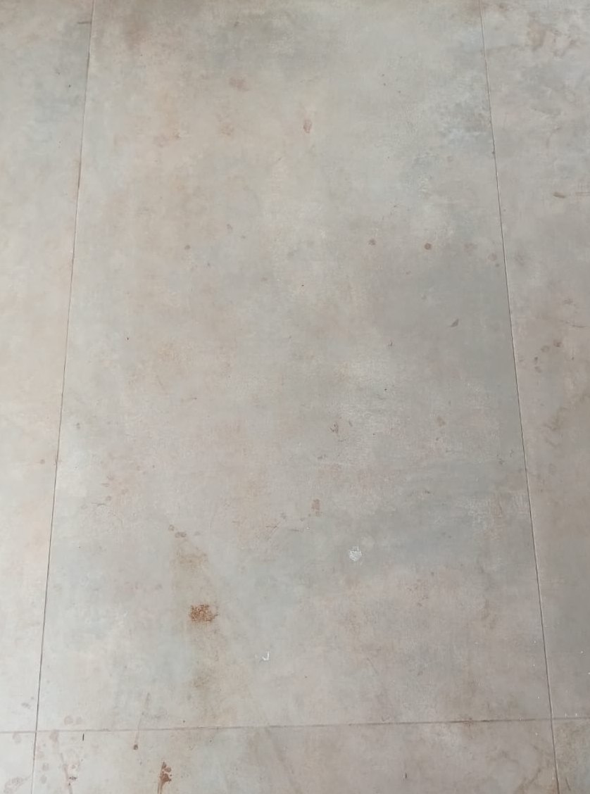 Rust marks off large-format tile — before cleaning
