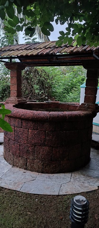 Laterite well, pressure washed clean — after cleaning by Filth Fighters