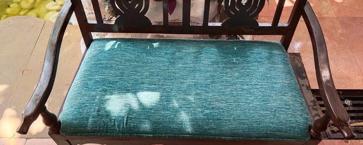 Teak settee, seat pad revived — after cleaning by Filth Fighters