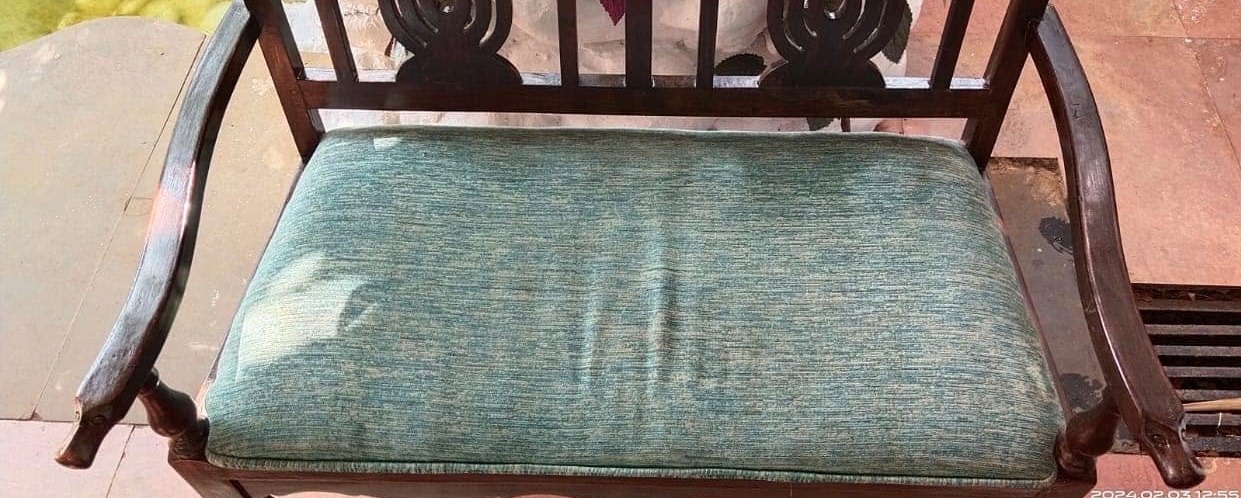 Teak settee, seat pad revived — before cleaning