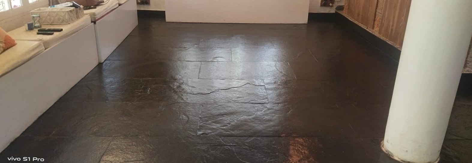 Stone floor, wax finish restored — after cleaning by Filth Fighters