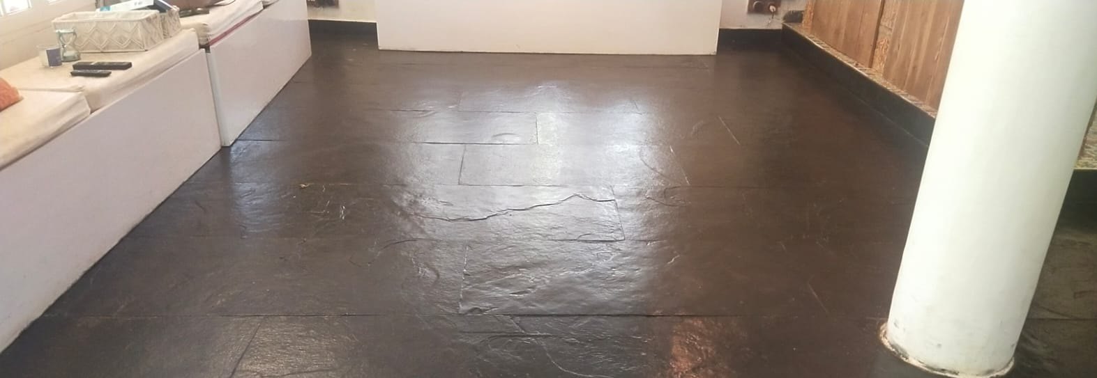 Stone floor, wax finish restored — before cleaning